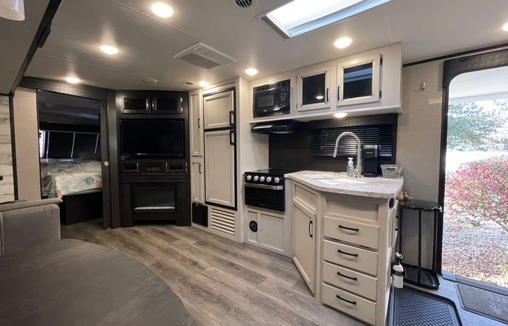 Plenty of kitchen counter space. Freezer, refrigerator, stove, and microwave