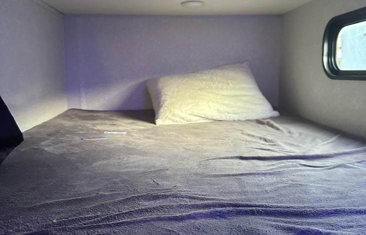 Top Bunk! Pack your own bedding or opt for ours! A sleeping bag or blanket works well!