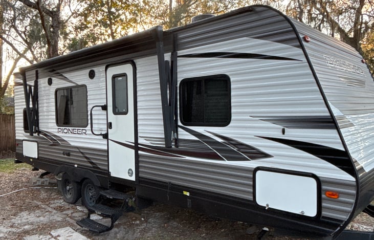 Full pass through storage in the front and smaller storage in the back (Little white door)