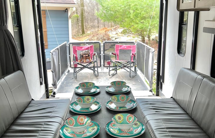 Plates, bowls and table included