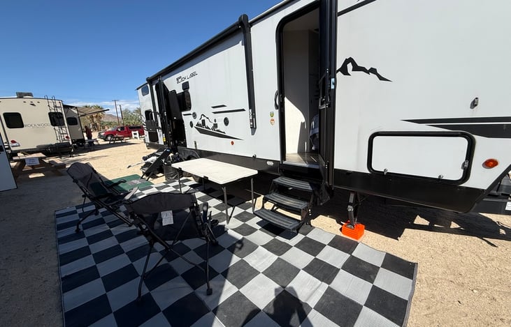 Side View of outside set up. Table, 2 chairs and mats are provided.