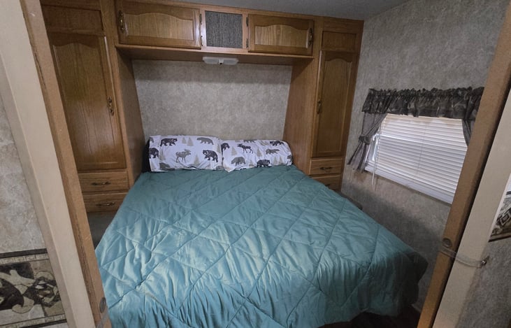 Queen bed with new mattress. sliding doors can make this room private