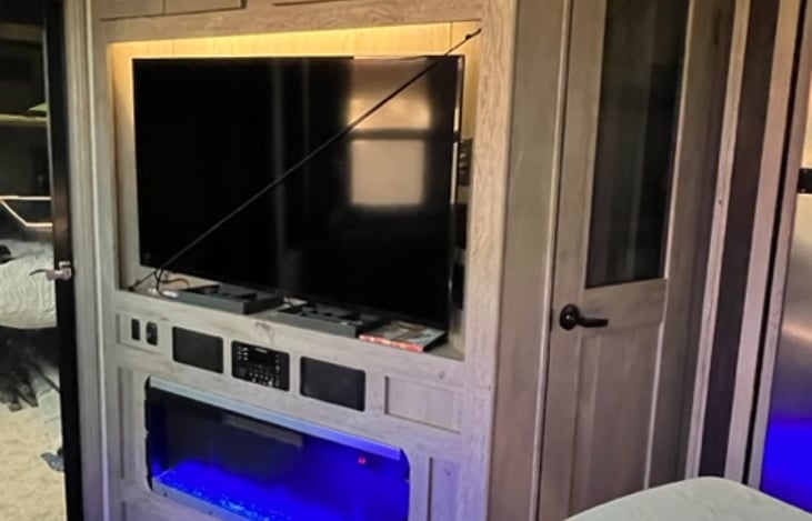 Living Rm TV with Electric Fireplace