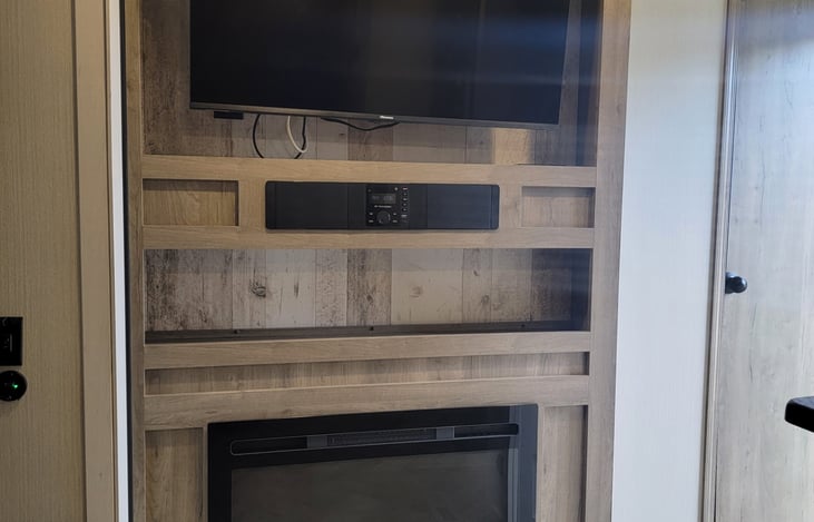 TV and Cozy Fireplace