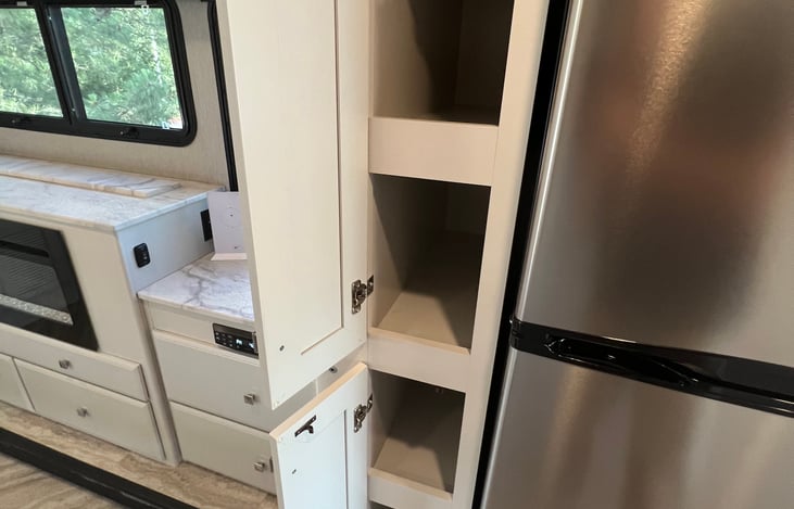Tons of deep pantry space. Not typical for RVs, but it's yours for the taking!