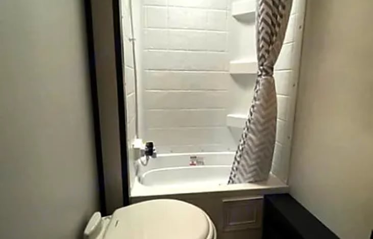 From the efficient use of space to the well-placed storage options and modern fixtures, this bathroom ensures you can freshen up and unwind while enjoying all the comforts of home.