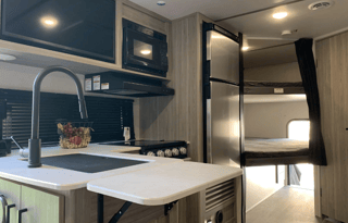 Sporty Little Giant Keystone RV Passport sleeps 7