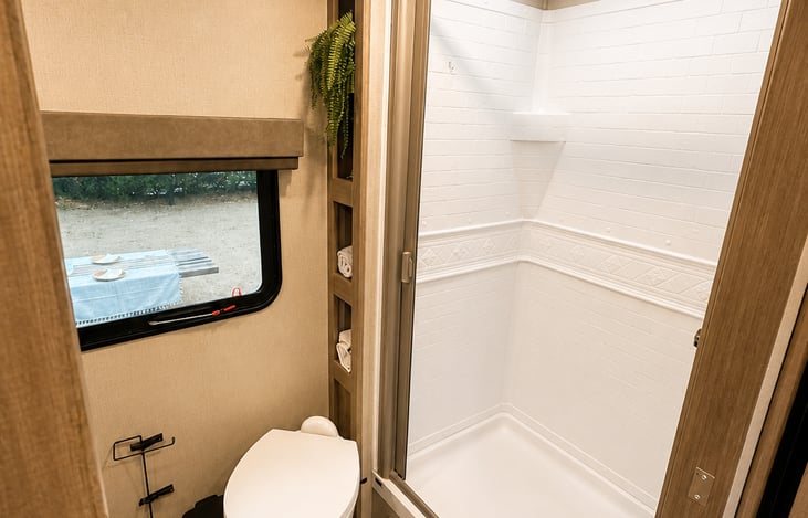 Camping doesn't have to mean a tiny bathroom. Enjoy a surprisingly spacious bathroom with a full-size shower and room to actually get ready comfortably.