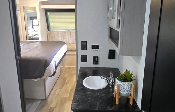 Full bath with vanity, walk in shower and toilet