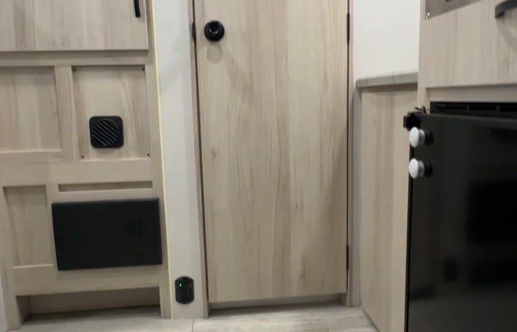 What you see as you enter is the fridge and microwave on the right and the door straight ahead to the bathroom