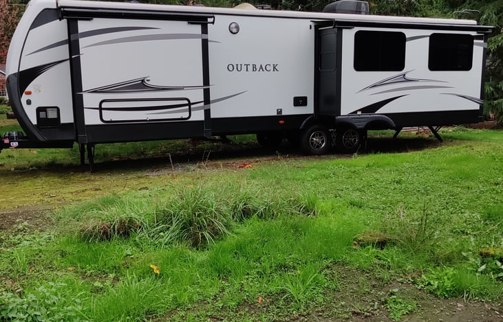 There is a flood light on this side makes for a nice lit area for outside showers or waste and fresh water hookups for those late arrivals.