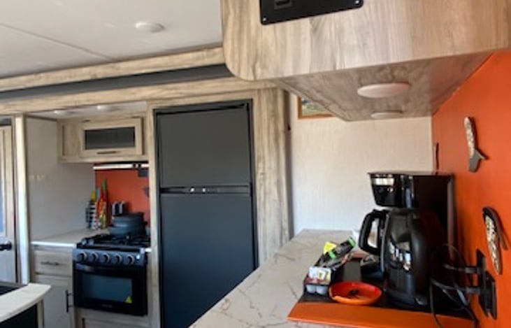 Recessed lighting above coffee bar and cooktop.  Additional power receptacles as well.