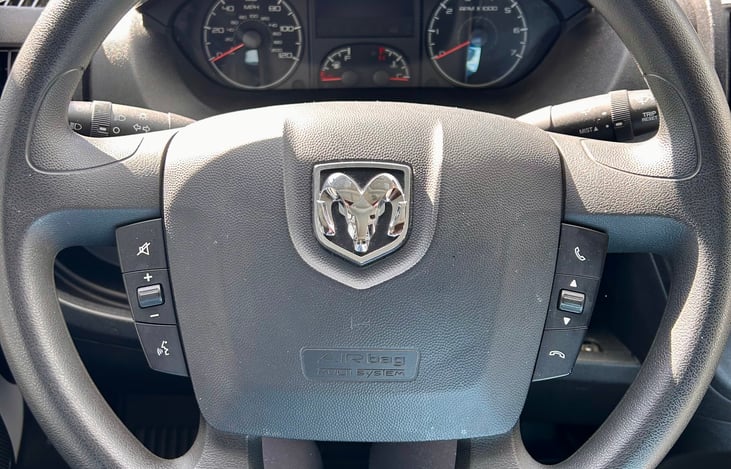 The steering wheel includes easy access buttons for the radio and phone.