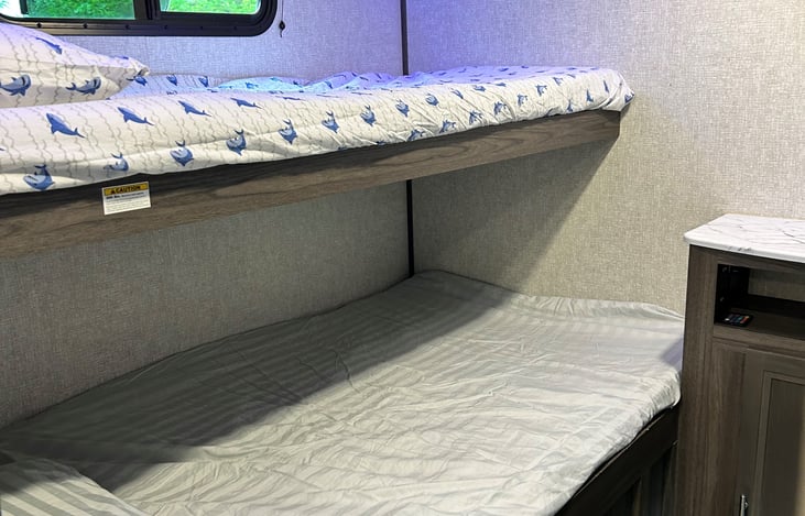 Stationary bunk beds. Bottom is a double, top is a twin.