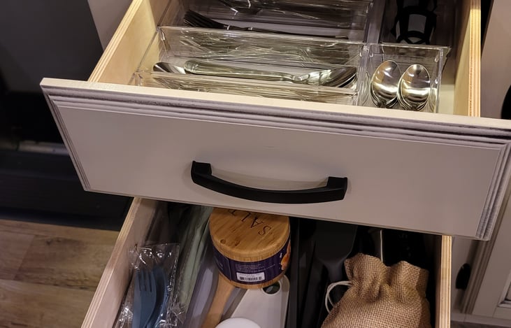 Dining and cooking utensils included.