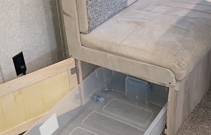 Pet supplies storage area. Under dinette