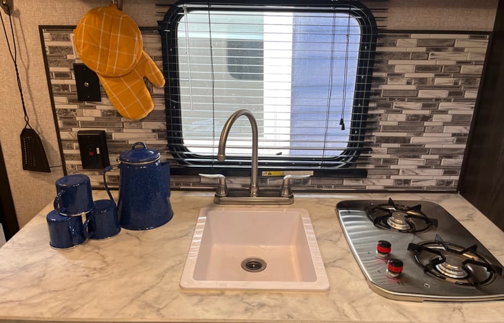 propane stove,  plates and cookware provided. Utensils below.  Cowboy/Pirate coffee set up!