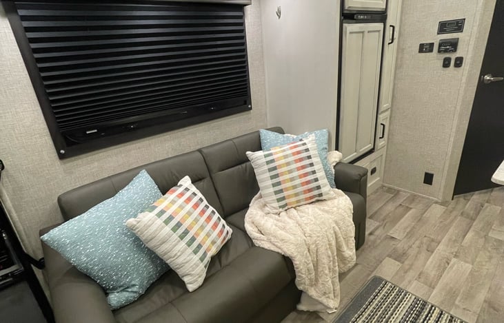 Sleeper sofa.  This can fit 2 children or an adult.  It has 2 seat belts.