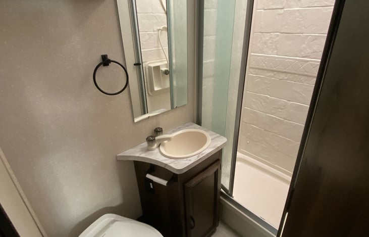 Nice sized bathroom with a full shower.