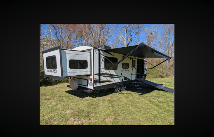 Exterior Camp side with Slide and Awning Out.