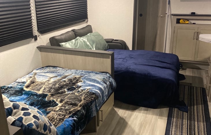 Dining room and living area converted to sleeping arrangements.