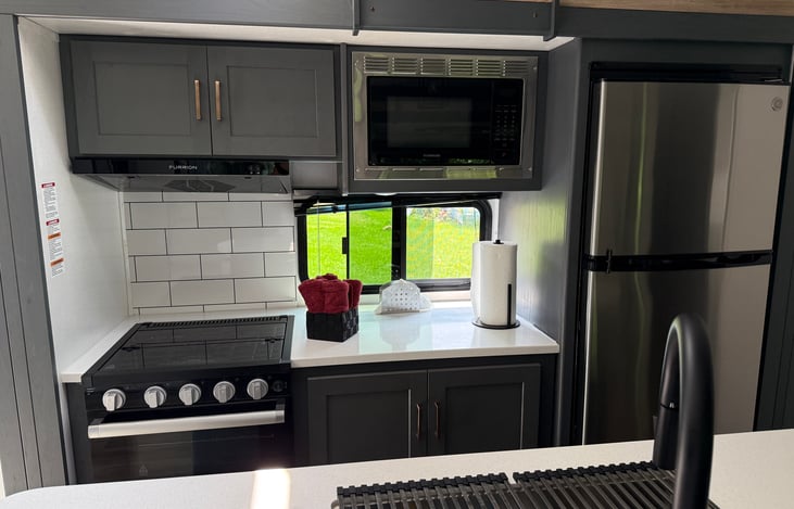 Full size refrigerator. Microwave. Gas stove and oven. Lots of storage