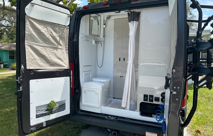 Rear entry with wet bath, outside outlets and light and outdoor spray hose