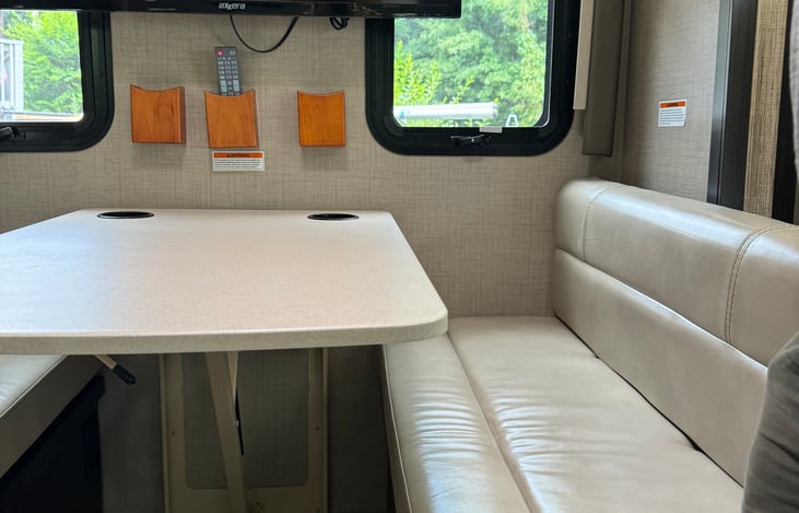 Table has 4 seatbelts for traveling safely