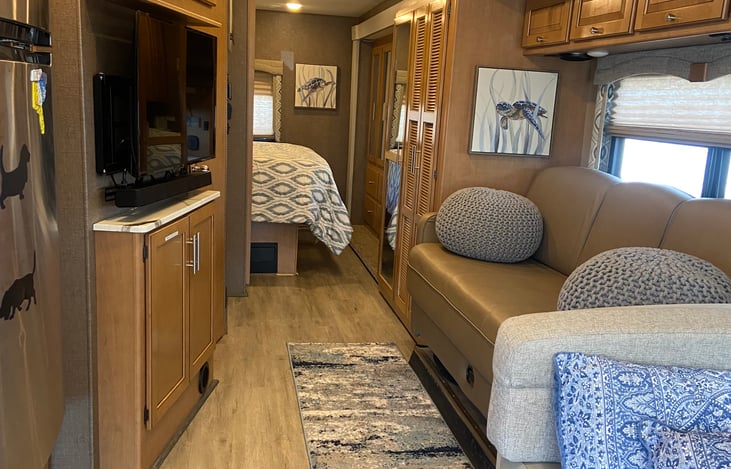 Warm interior with jack knife sofa-storage underneath