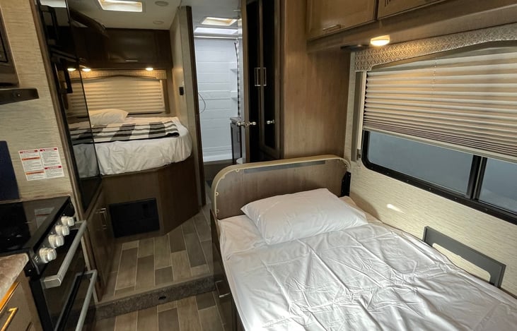 A convertible dream dinette bed can sleep one adult. Bedding can be included as an add-on, see our add-ons list.