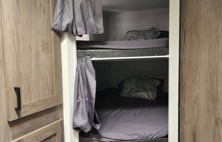 Pull the curtain for more privacy in either bunk.