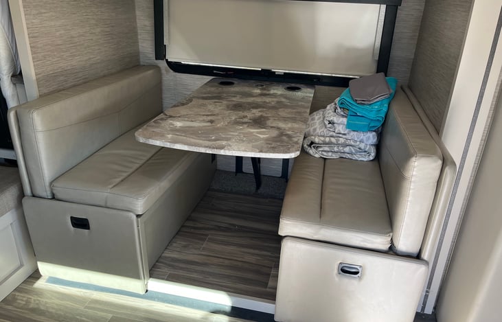 Kitchen table lowers to accommodate more sleeping space.