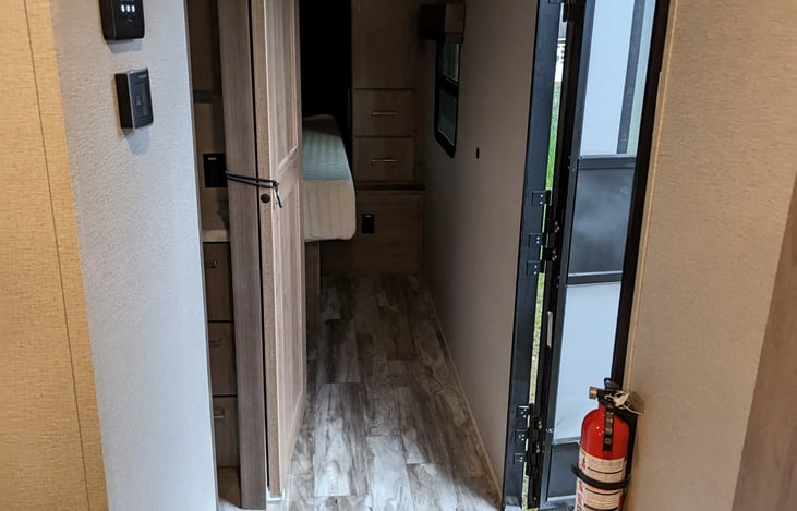 Entry hallway gives easy access to living space, sleeping space and the bathroom