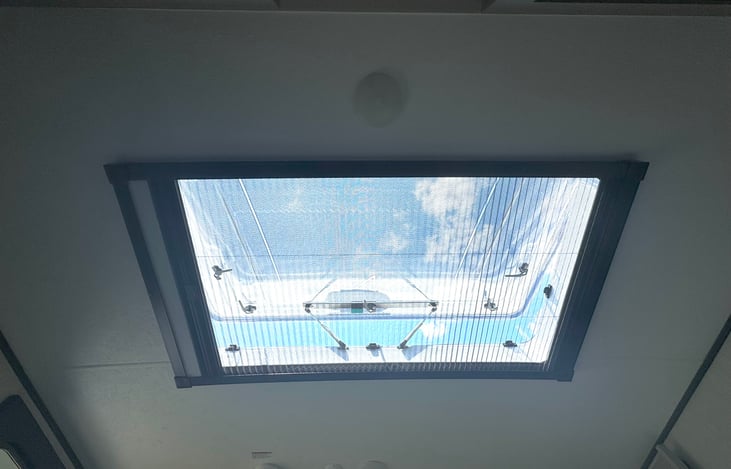 Large, openable "Stargazer" skylight over the bed, includes insect screen and blackout shade
