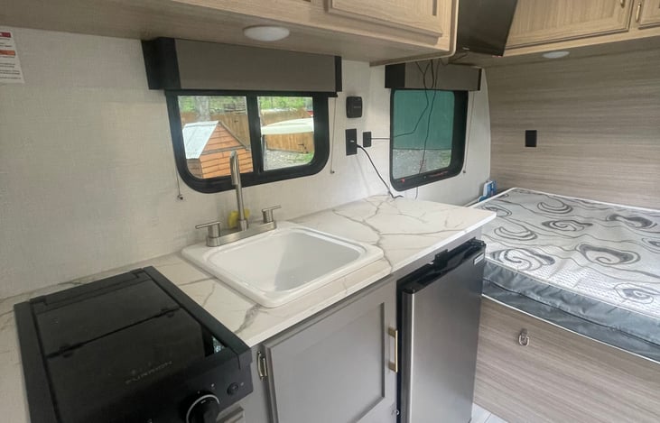Galley with bed in the background.