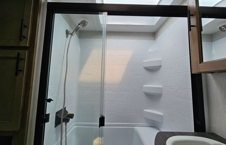 Master bathroom. Includes full-size shower, porcelain toilet, sink vanity and lots of storage