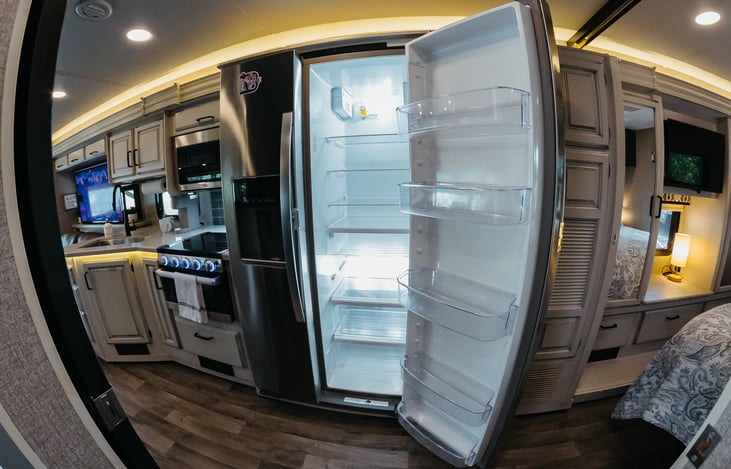 Full Whirlpool residential kitchen with filtered water and ice in the door.