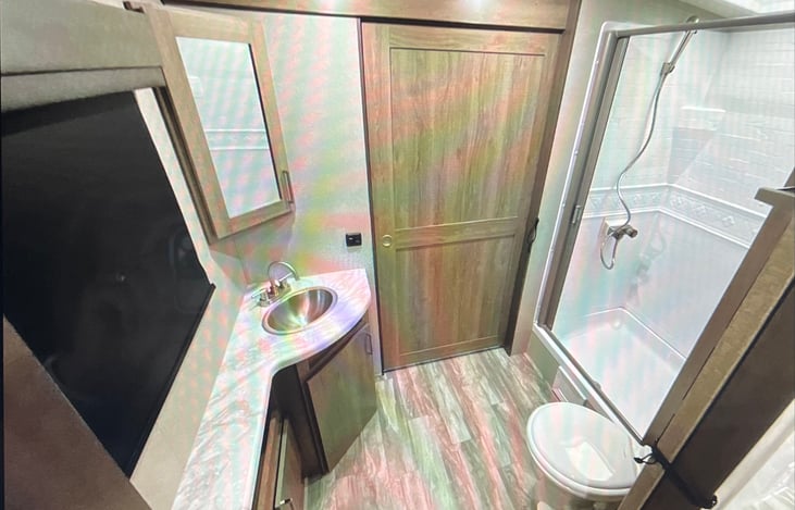 restroom has full shower with towels.