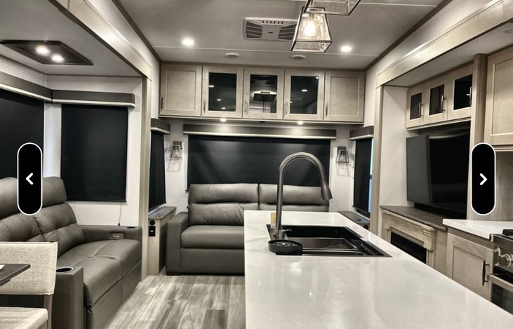 living room with reclining sofa; and sofa bed