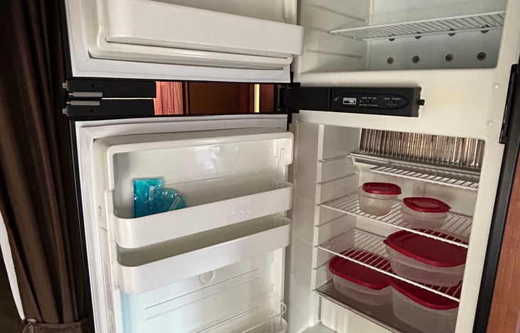 Fridge & freezer.
Some plastic food storage containers are provided.