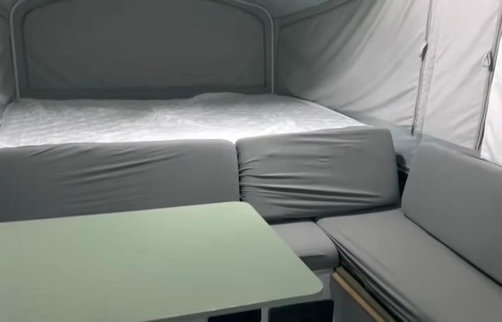 Indoor table that converts to a small bed