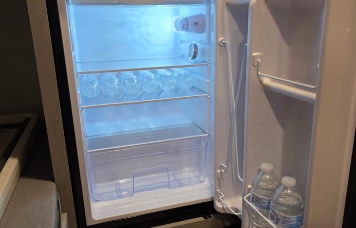 3.3 Cubic ft refrigerator, pre stocked with 8 cold waters