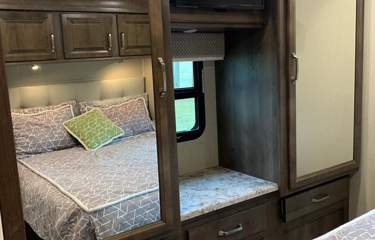 Two large closets and storage on bottom