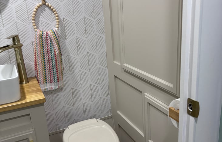 Bathroom includes hand towels, bath towels, hand soap, and toilet paper.