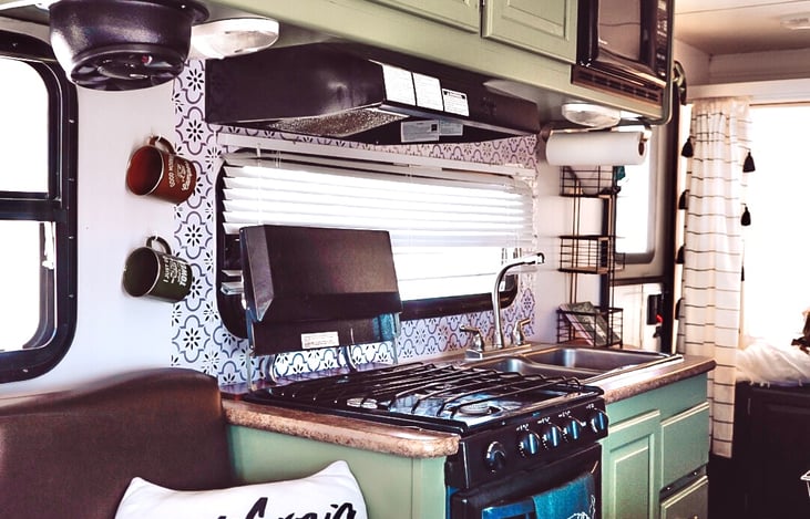 Microwave
Double sink
3 burner stove
Oven