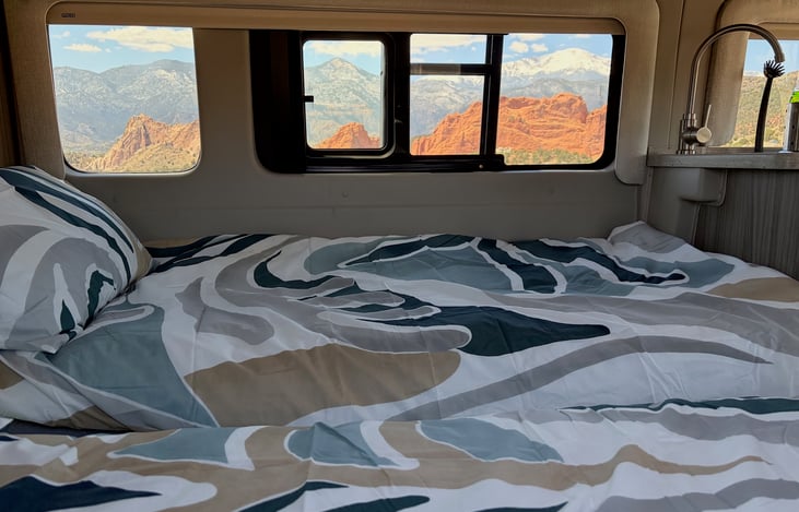 Imagine waking up in your cozy bed to breathtaking views framed by panoramic windows.