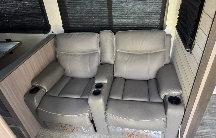 Reclining Theater seats facing the 42" TV.