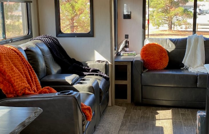 Comfortable recliners with built-in heat and massage.  Convenient storage cubbies on either side of tri-fold sofa.