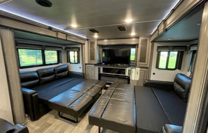 Front living area with queen beds extended.