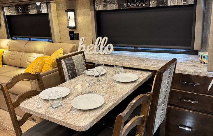 Dinner time! Table extends to seat 4 comfortably; storage above and around table.